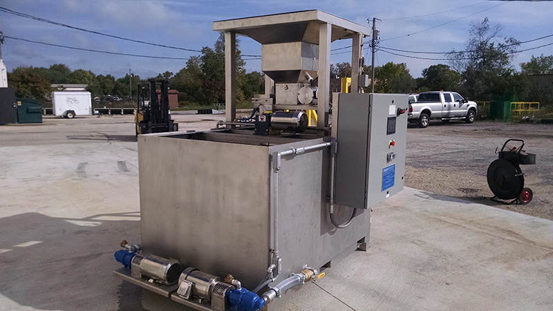 A picture Clearwater Industries Model 300 Stainless Steel PLC with it's big bag pan to hopper feed and pump system.