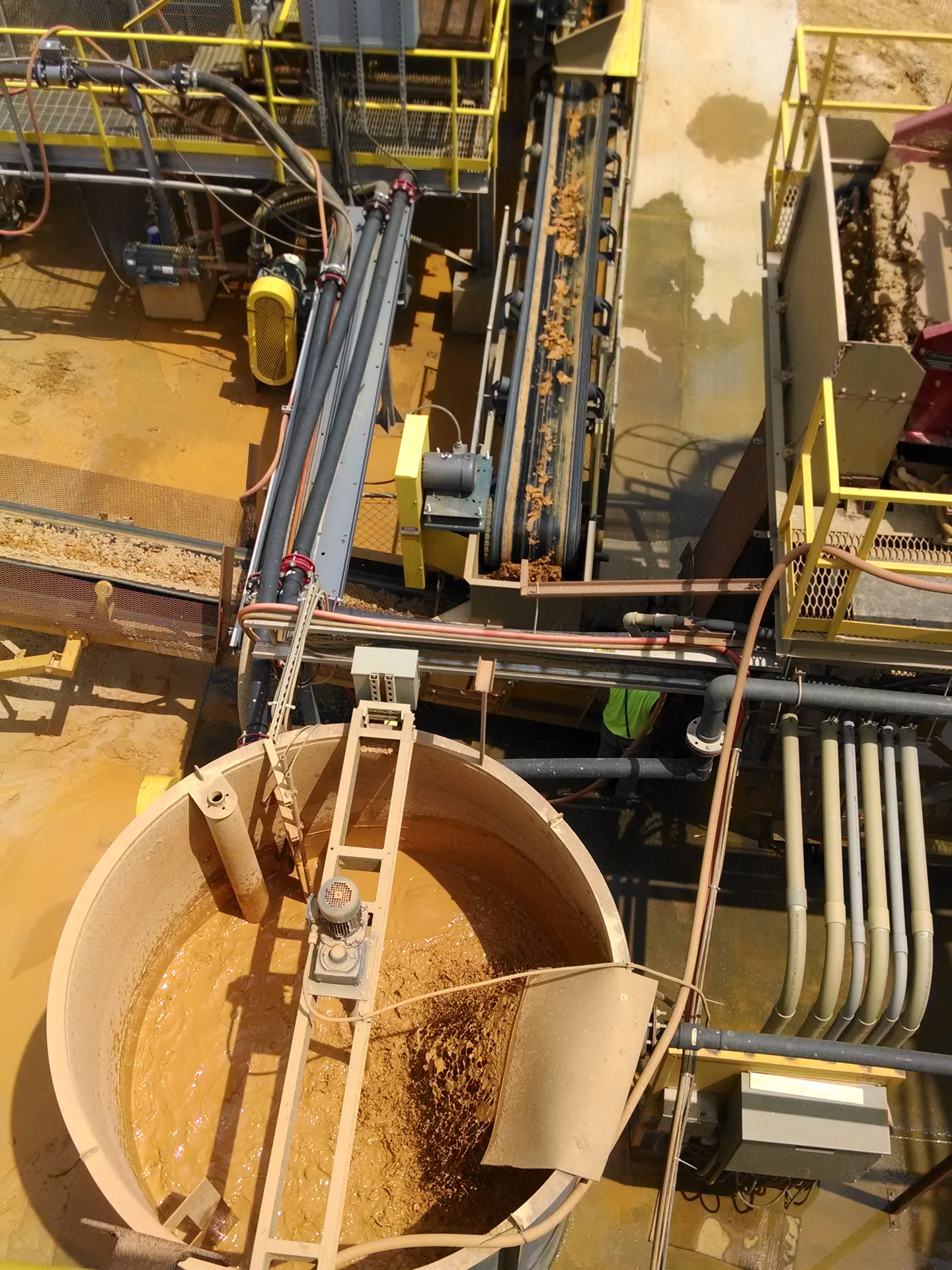 An above view of a section of a sand washing plant with conveyor belts taking aggregates to different locations.
